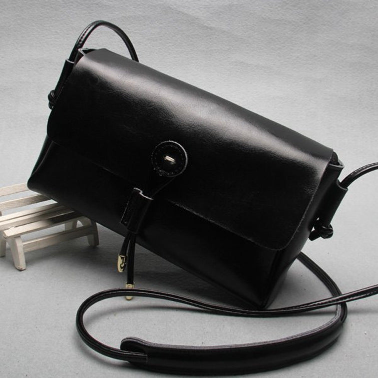 VogueVision Buttoned Elegance - Women Leather Bag - NYXIE