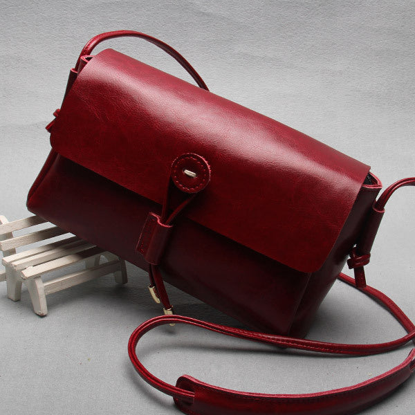 VogueVision Buttoned Elegance - Women Leather Bag - NYXIE